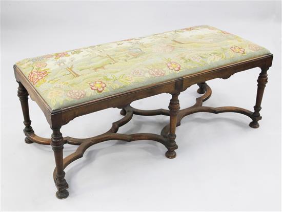 A late 17th century style walnut stool, W.4ft 5in.